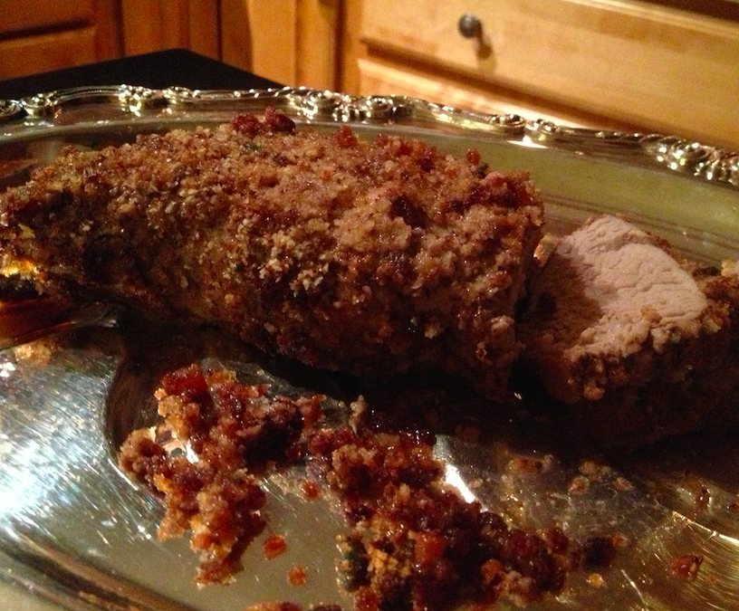 Crusted pork loin on silver platter