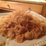 Plate of cooked sauerkraut with apple