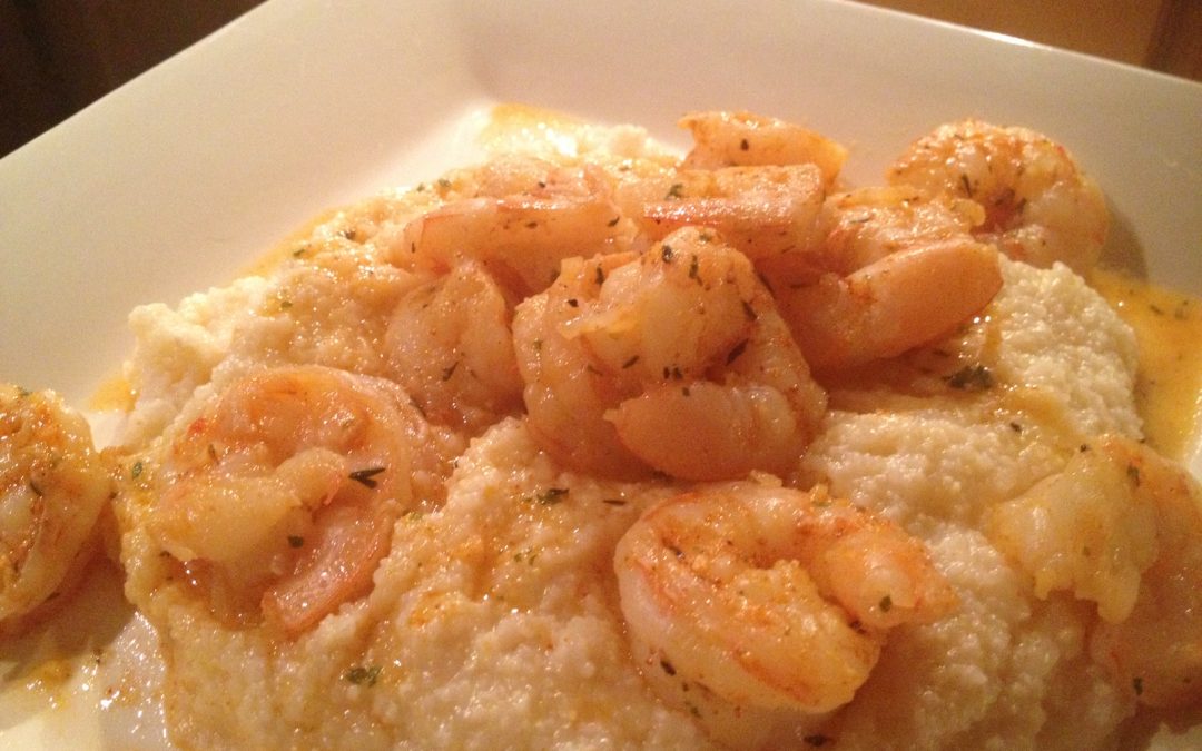 Shrimp and grits on white plate