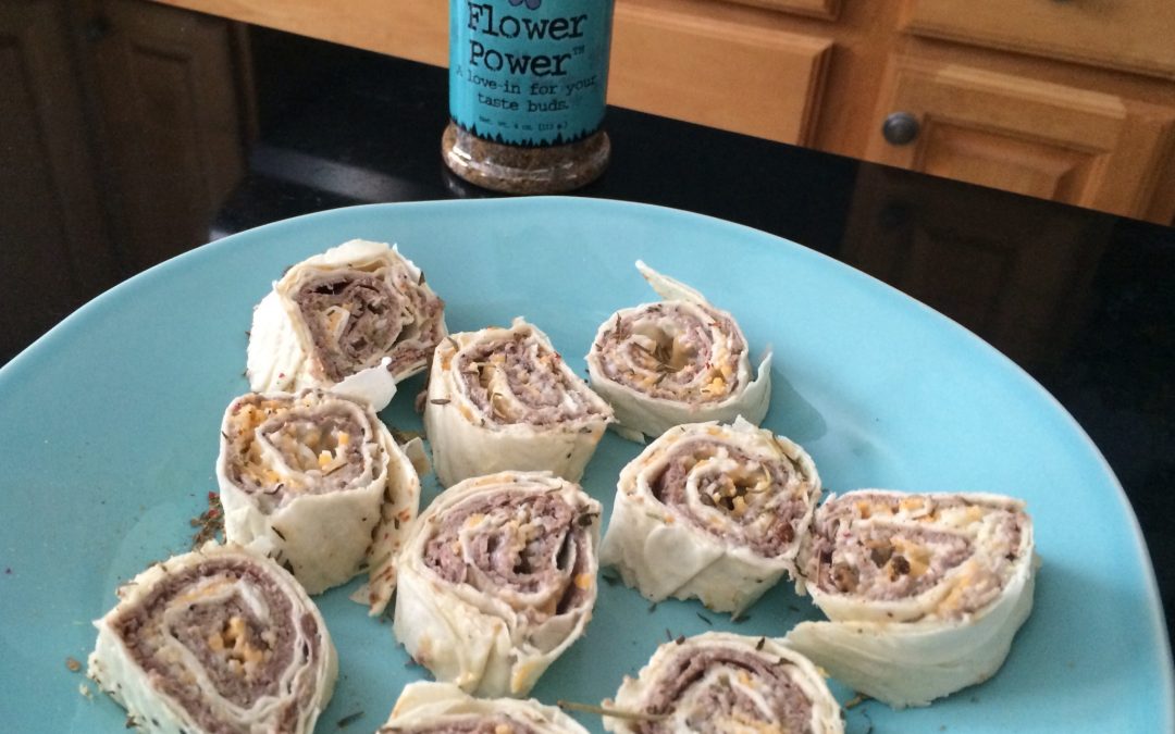 Sliced tortilla pinwheels on a blue plate