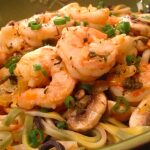 Shrimp and mushroom pasta with scallions