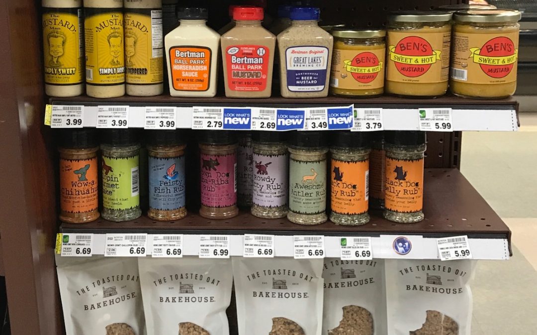 Grocery shelf with condiments and crackers