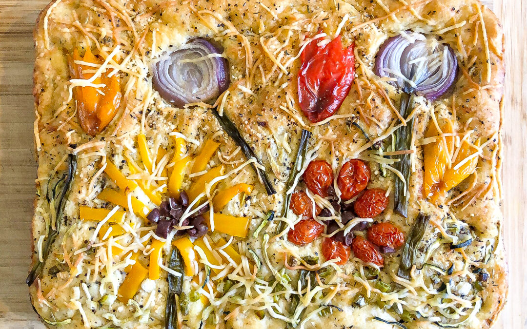 Rectangular vegetable focaccia with colorful toppings